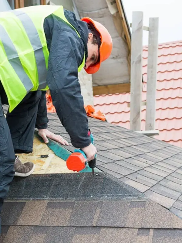 A roof engineer doing an asphalt roofing repair in Jersey.