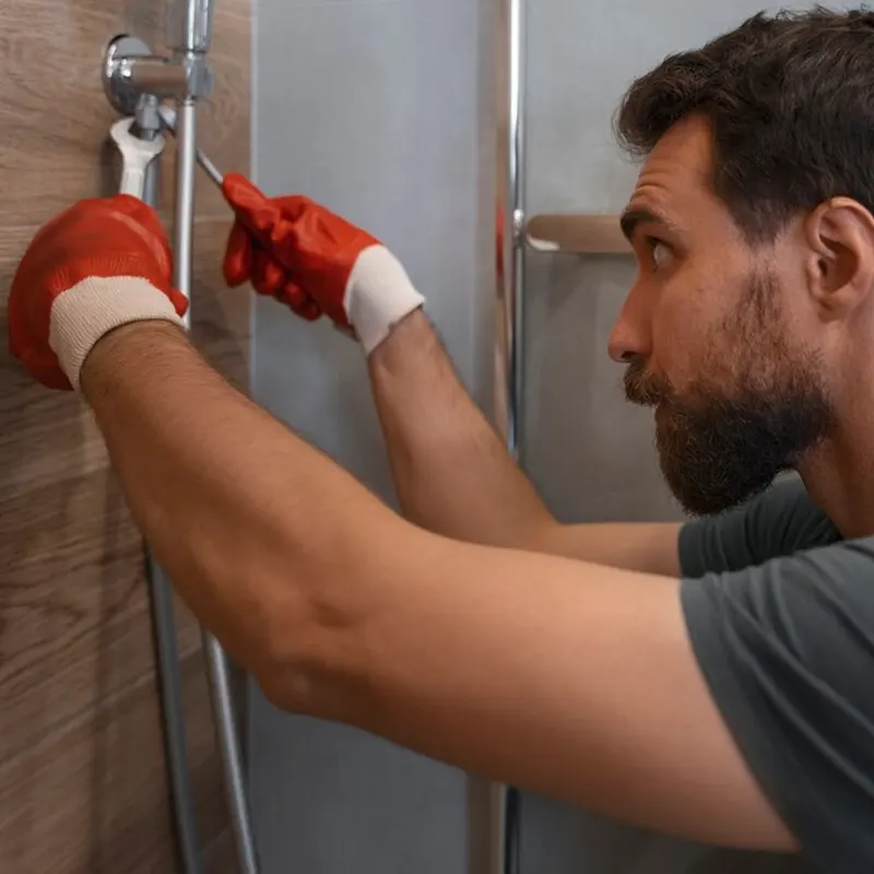 A bathroom tradesmen in jersey doing a bathroom fitting repair.