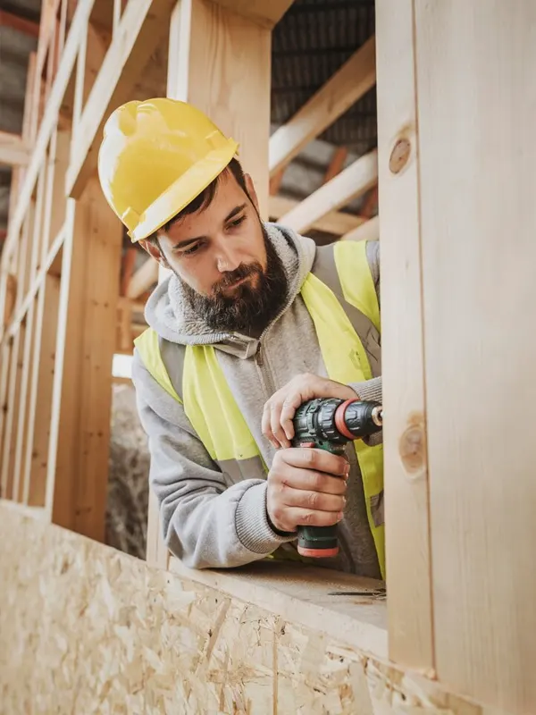 Expert carpenter in jersey working on a framing of a home in St. Helier, Jersey.