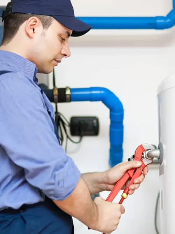 An emergency heating engineer in Jersey repairing a hot water system to restore heating quickly and efficiently.