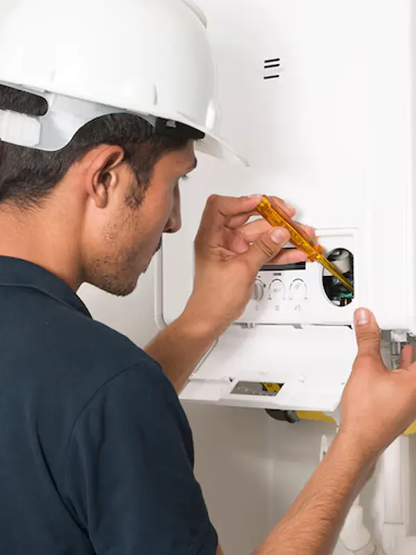 A Jersey heating technician performing an emergency boiler repair to restore heating and hot water quickly.