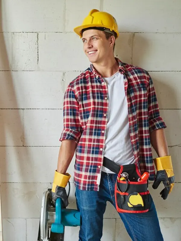 A handyman tradesman in a Jersey home doing home repairs.