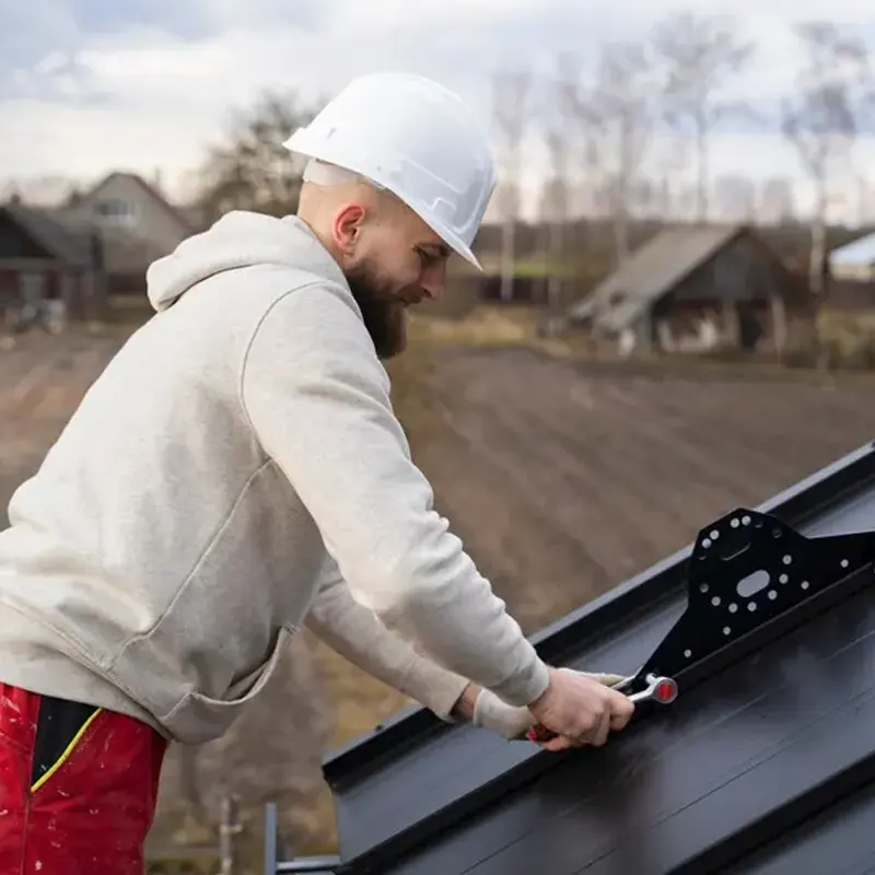Emergency roofing repair being made in a residential roof in Jersey.
